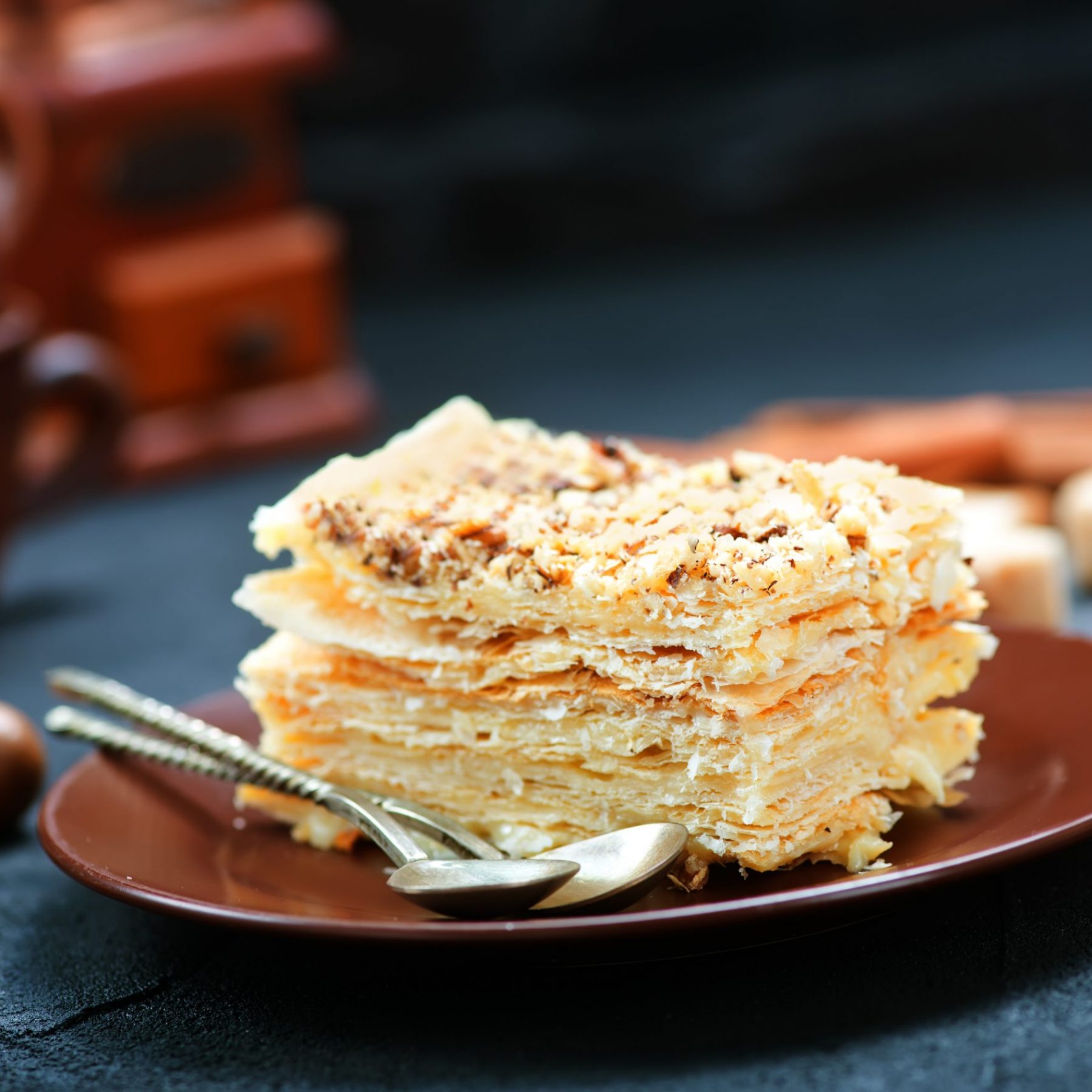 Napoleon tart on plate and on a table